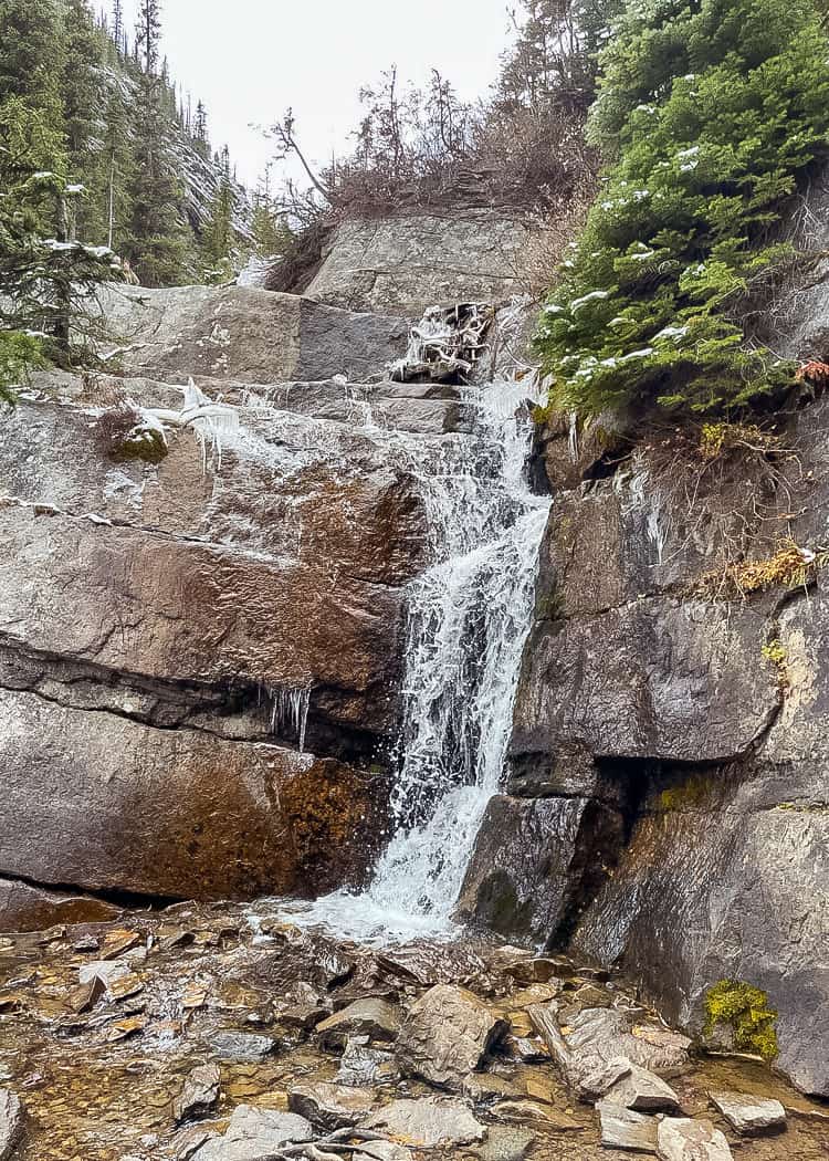 Lake-Agnes-Tea-House-Hike-waterfall-next-to-stairway