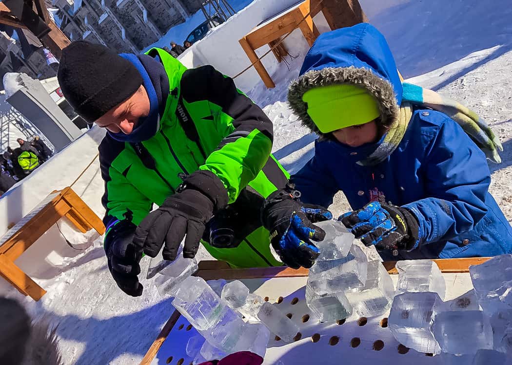 Quebec-Winter-Carnival-playing-with-ice-blocks-boys