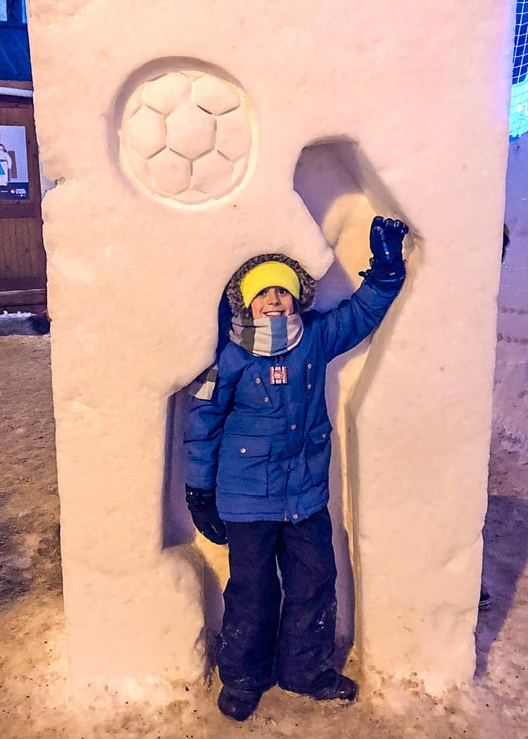 Quebec-Winter-Carnival-snow-sculpture-boy-soccer