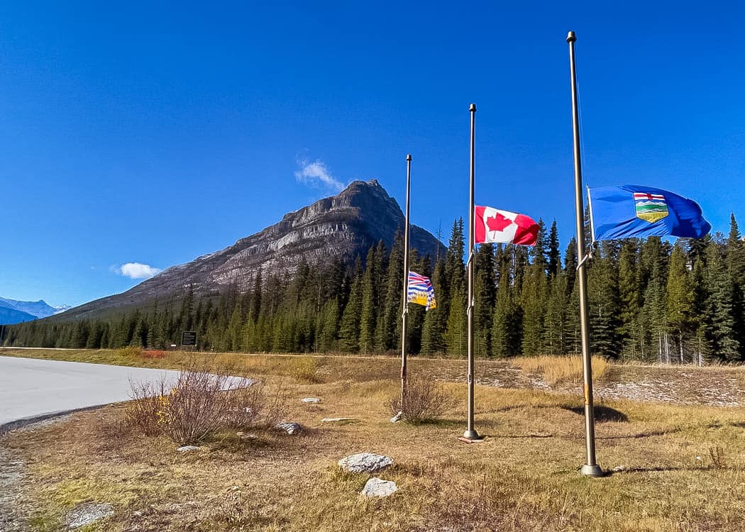 Kootenay-National-Park-Continental-Divide-flags-and-parking-lot