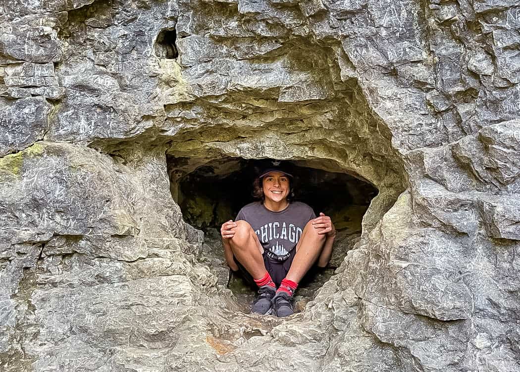 Elora-Hiking-kid-in-small-cave