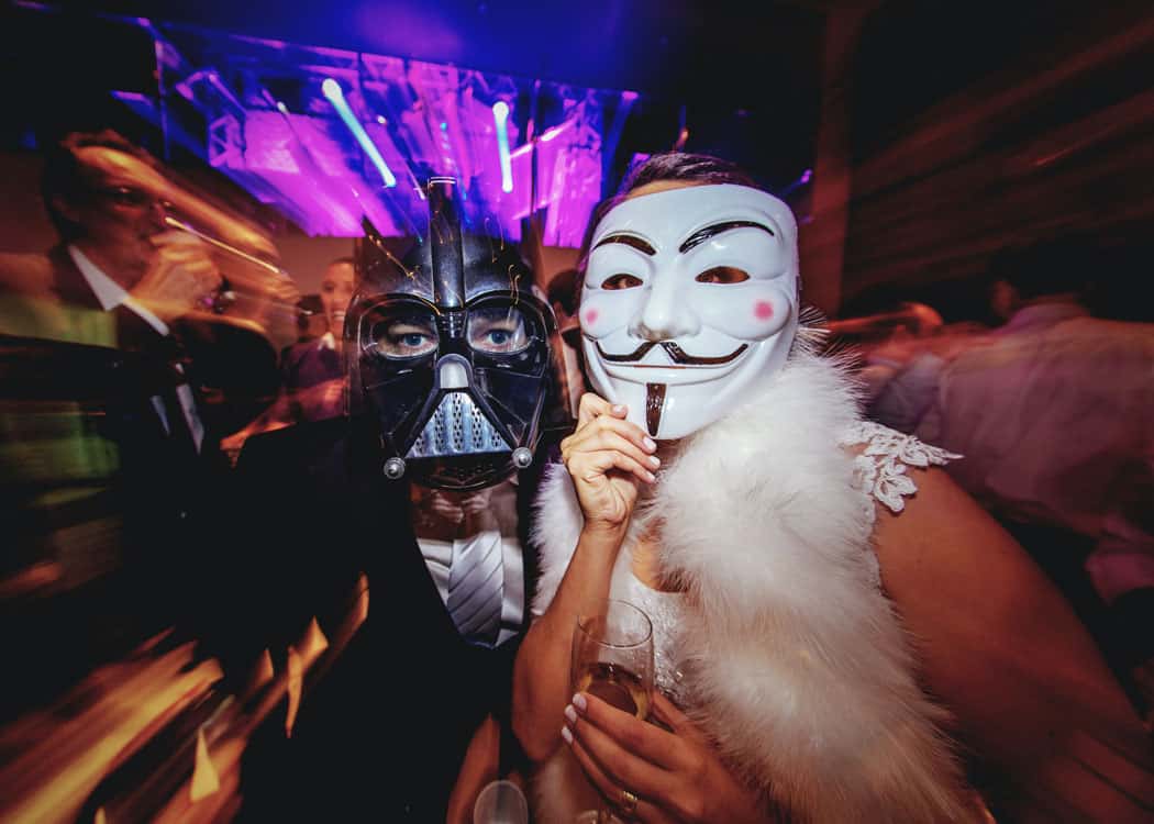 couple at party wearing masks