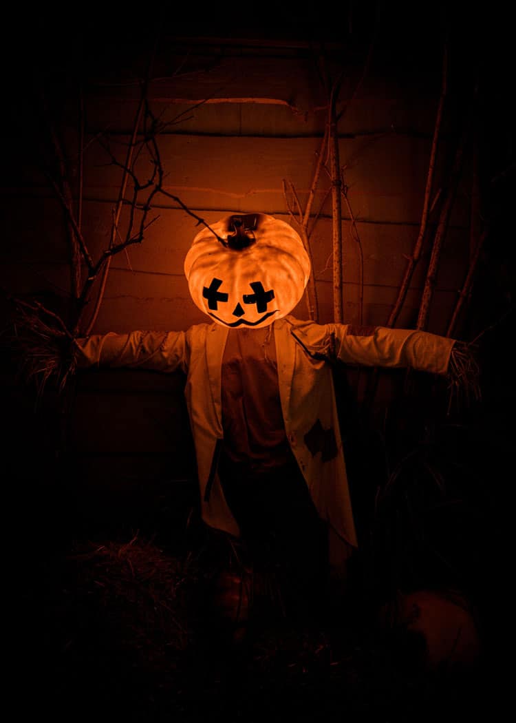 man with glowing pumpkin head