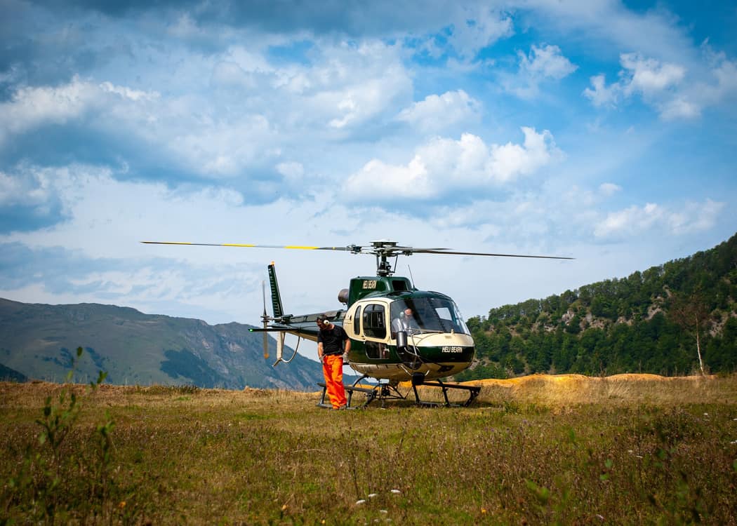 Jasper-Helicopter-Tours-heli-landed-on-mountaintop-meadow