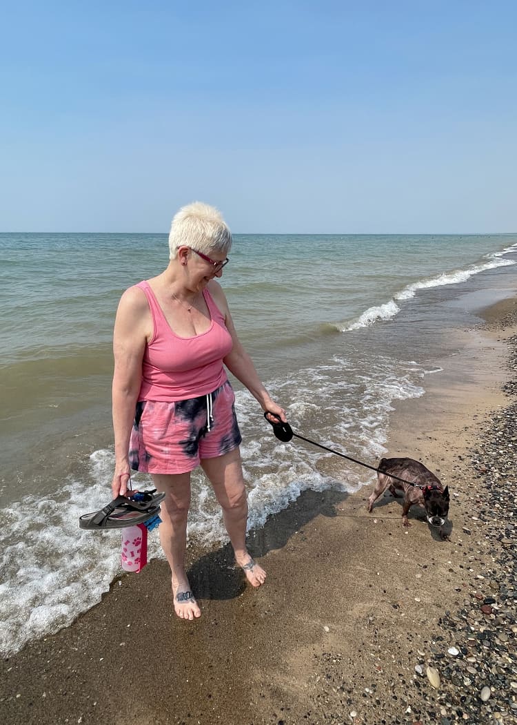 Sharks-in-the-Great-Lakes-Lady-and-a-dog-in-the-water