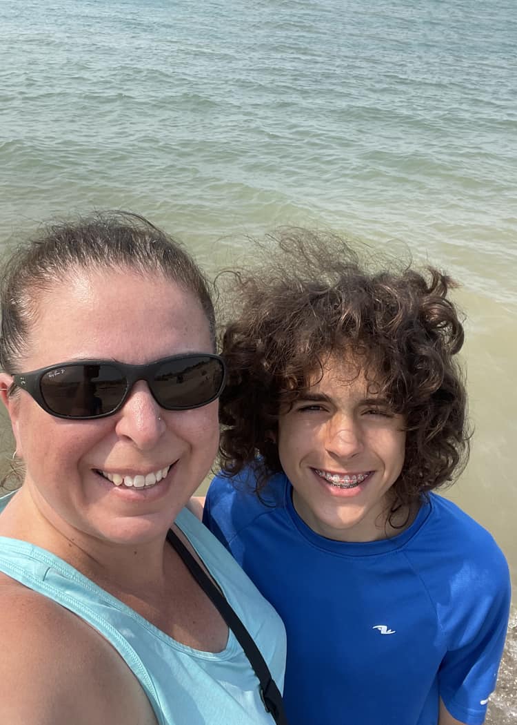 Sharks-in-the-Great-Lakes-mom-and-son-posing-in-front-of-water