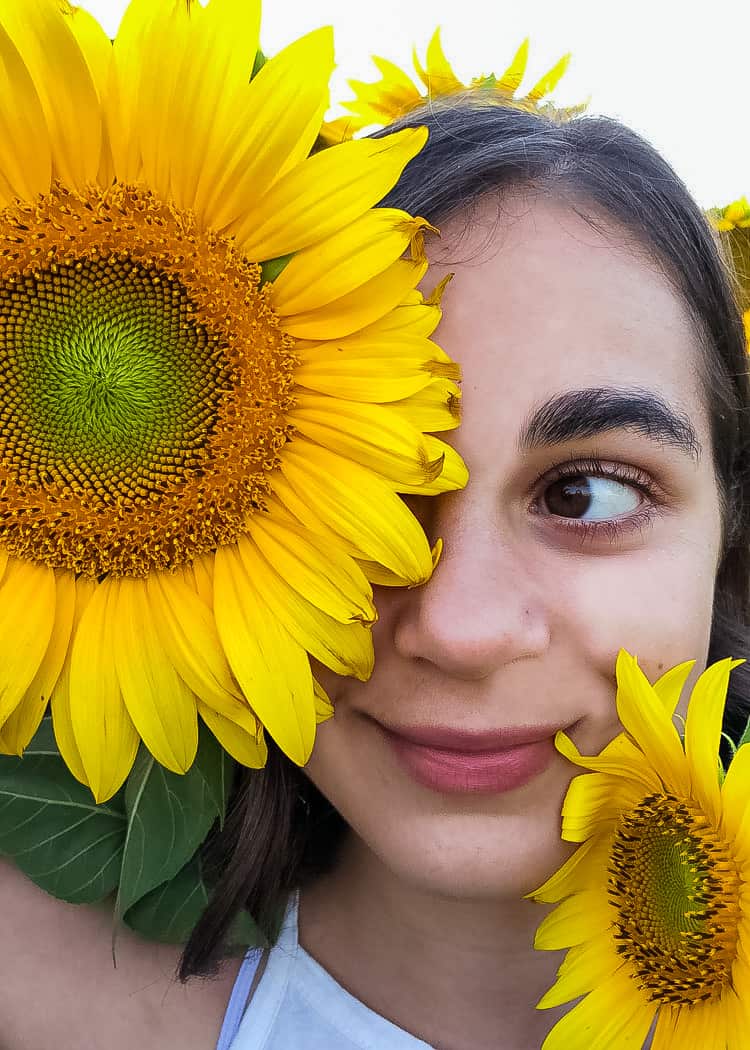 Sunflower-Girl-with-flowers-covering-her-face